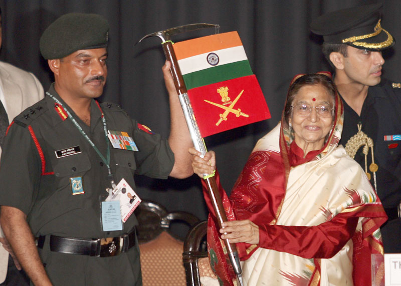 The President, Smt. Pratibha Devisingh Patil receiving the flags from...
