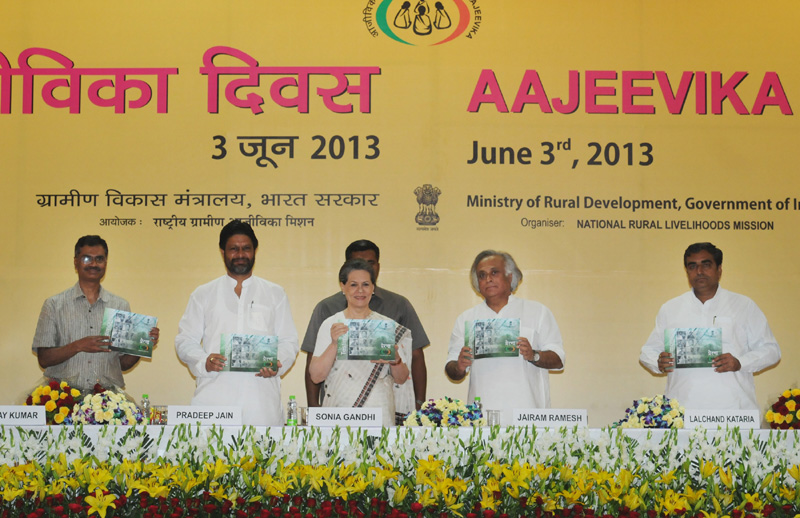 The Chairperson, National Advisory Council, Smt. Sonia Gandhi releasing a book, at the AAJEEVIKA DIWAS 2013, in New Delhi