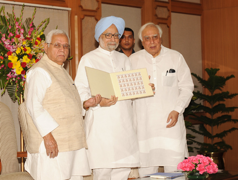 The Prime Minister, Dr. Manmohan Singh releasing the commemorative postage stamp...