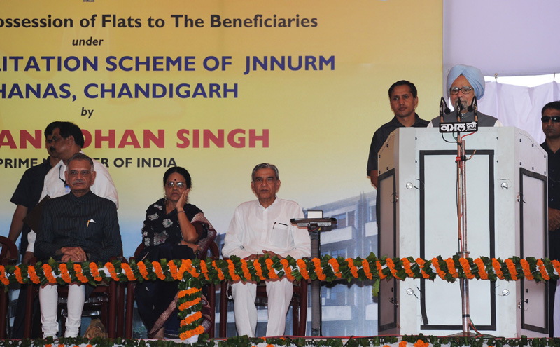 The Prime Minister, Dr. Manmohan Singh addressing at the handing over possession...