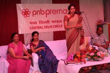 President, PNB Prerna ,Smt. Pushpa Kamath distributes candle making machine  and...
