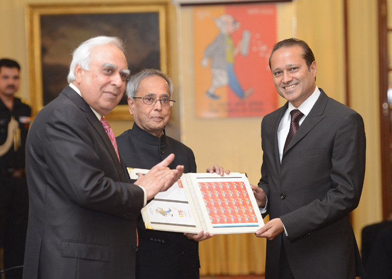 The President of India, Shri Pranab Mukherjee releasing the commemorative stamp...