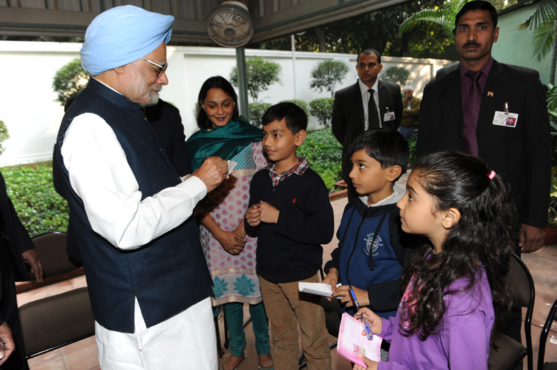 The children greeting the Prime Minister, Dr. Manmohan Singh and getting his autograph, ...