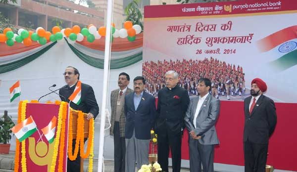 K. R.KAMATH, CMD, PNB UNFULRS NATIONAL FLAG AT BANK H.O TO COMMEMORATE INDIA 65TH REPUBLIC DAY