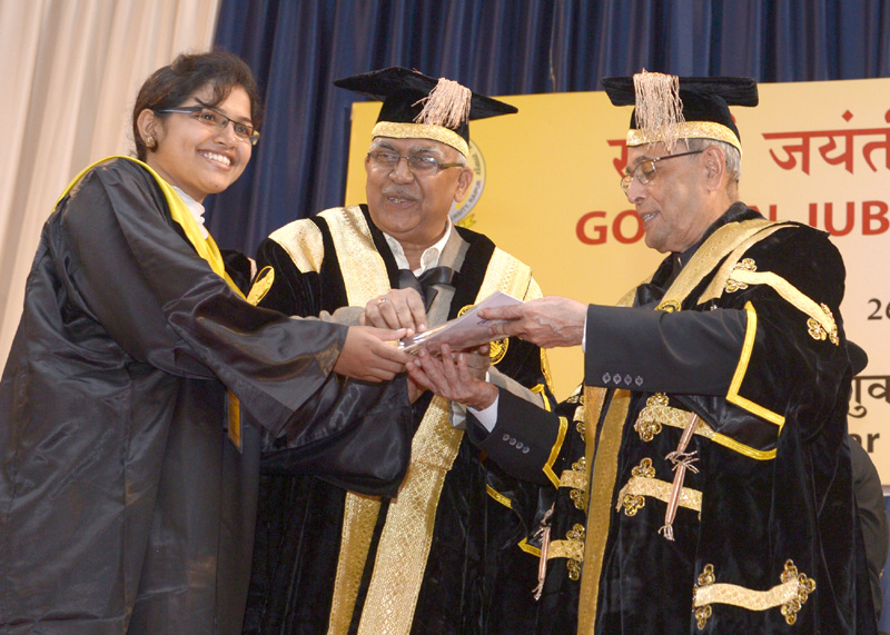 The President, Shri Pranab Mukherjee presenting the degree to a…