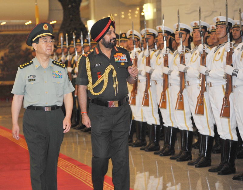 The Chief of Army Staff, General Bikram Singh inspecting the Guard of Honour with ...