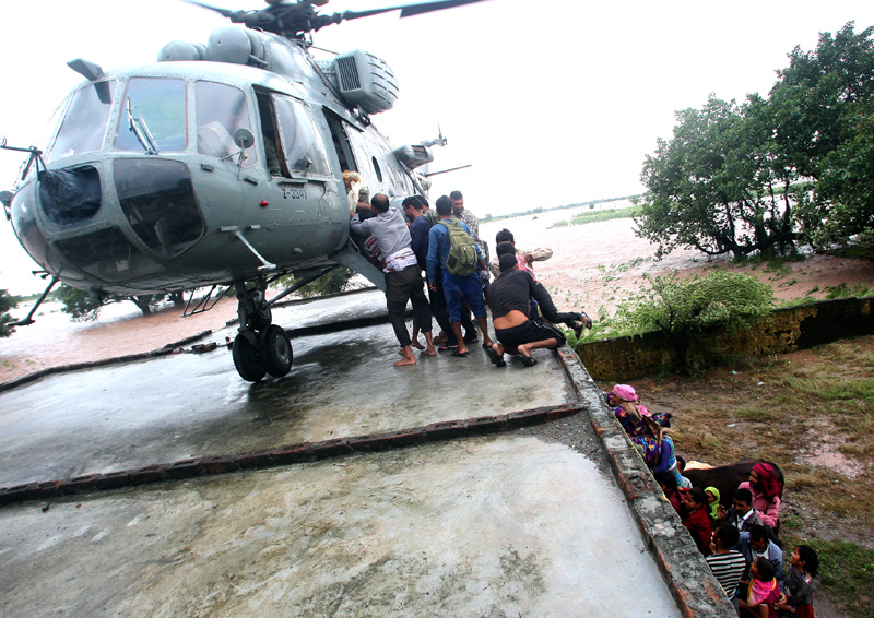 The Indian Air Force Helicopters carrying out rescue, relief and evacuation of ...
