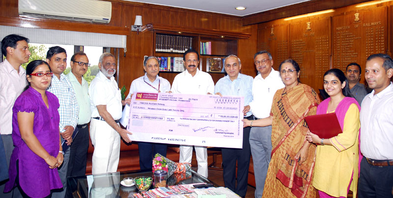 The Union Minister for Railways, Shri D.V. Sadananda Gowda receiving a cheque...