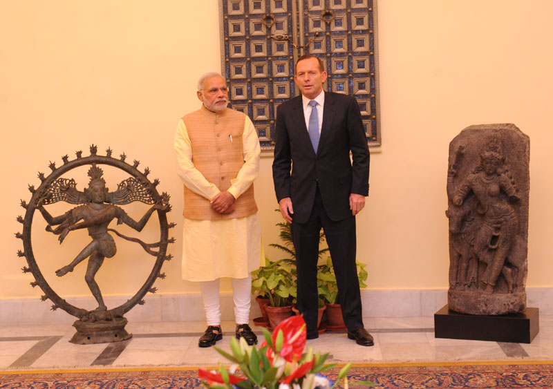 The Prime Minister of Australia, Mr. Tony Abbott returning the two antique...