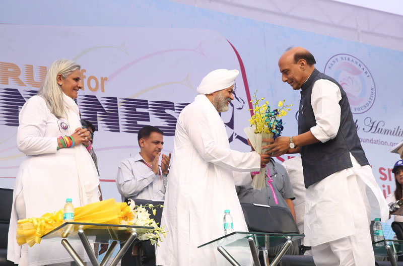 The Union Home Minister, Shri Rajnath Singh being presented a bouquet of ...