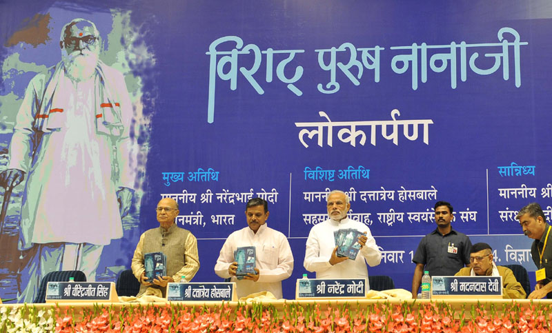 The Prime Minister, Shri Narendra Modi releasing the book ‘Virat Purush Nanaji’...
