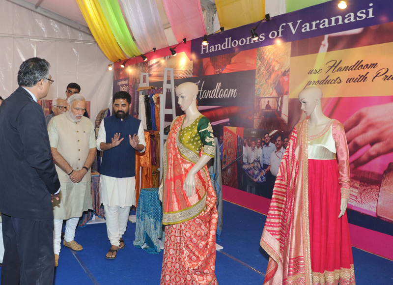 The Prime Minister, Shri Narendra Modi visits an exhibition on the venue for ...