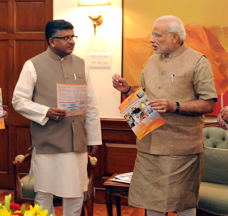 The Prime Minister, Shri Narendra Modi with the Union Minister for Communications ...