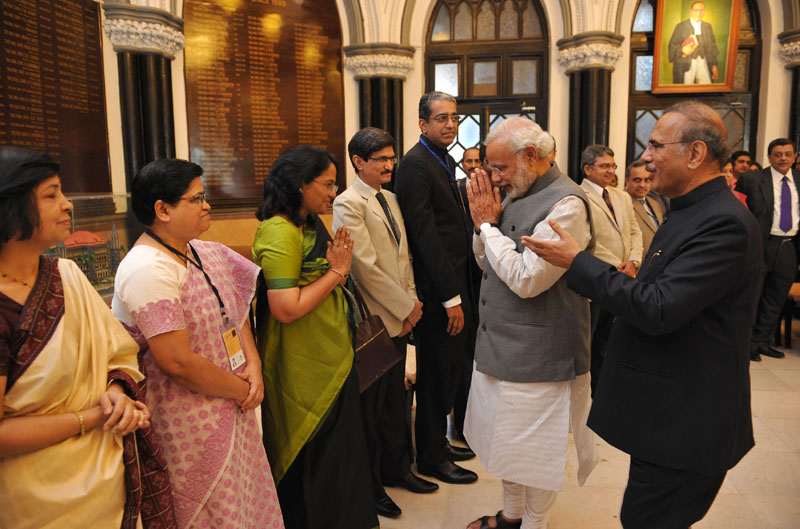 The Prime Minister, Shri Narendra Modi interacting with the officials at the ...