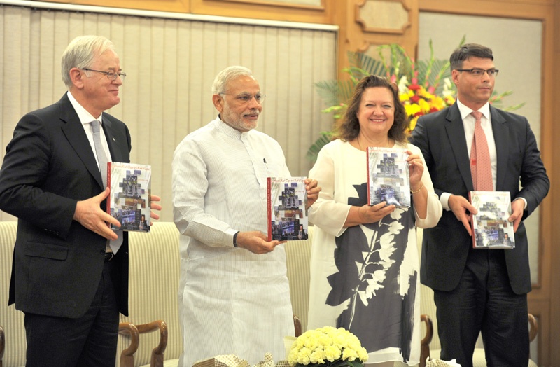 The Prime Minister, Shri Narendra Modi releasing the book "Red Tape to Red Carpet... and then some",.